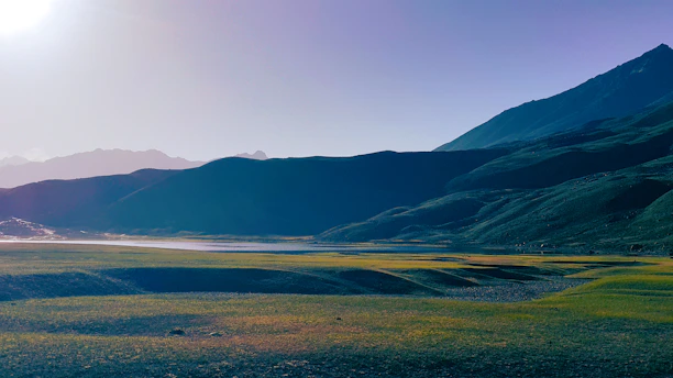 A serene landscape with rolling hills and a clear blue sky, symbolizing growth and exploration.