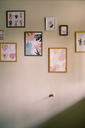 Gallery wall featuring framed Hahnemühle prints with elegant Japanese and German design influences.