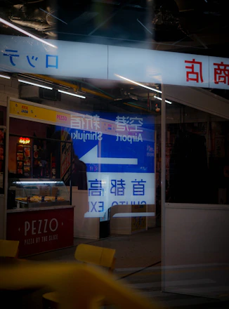 A vibrant storefront featuring a mix of digital and traditional signage by SN Corporate Signs.