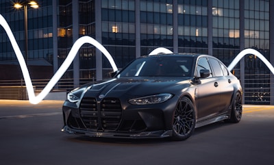 Front view of a sleek modern sedan in a city setting