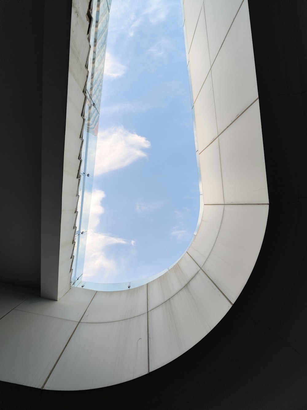 a view of the sky through a circular window