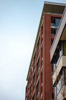 Wide shot of a completed brick facade with modern architectural design.