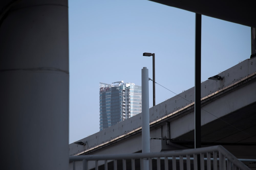 a view of a tall building from across the street