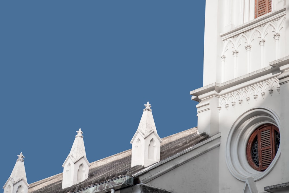 a church steeple with a blue sky in the background