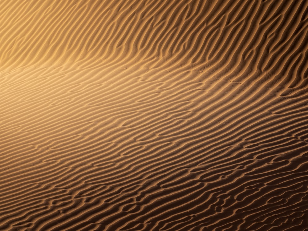 a large sand dune in the middle of a desert