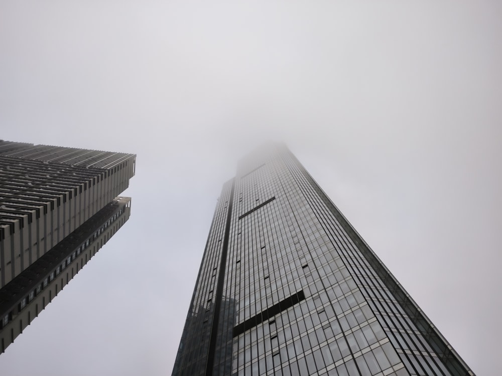 a very tall building with a very foggy sky in the background