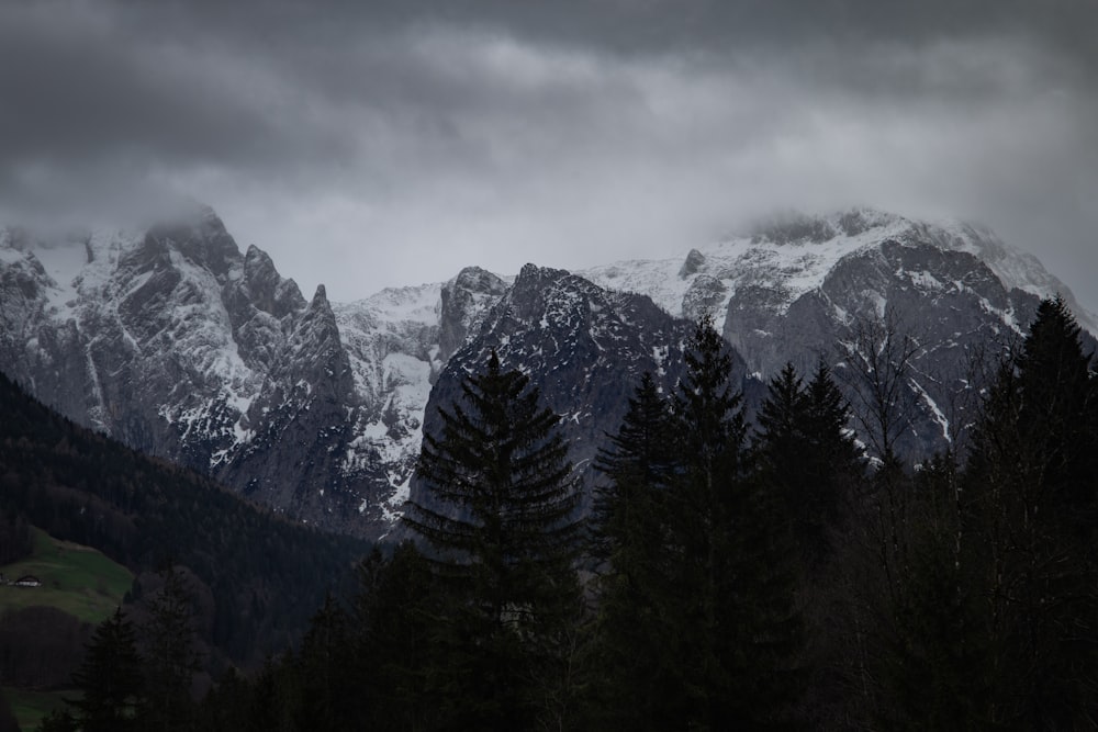 a mountain range with snow covered mountains in the background