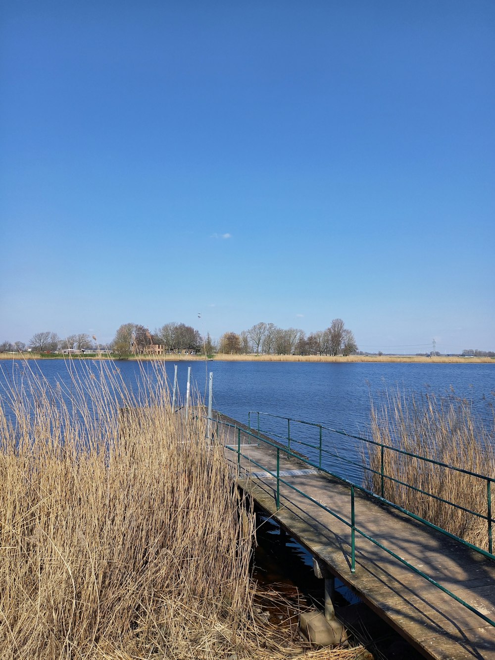 a wooden dock sitting next to a body of water