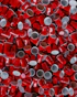 a pile of red and white cups sitting on top of each other