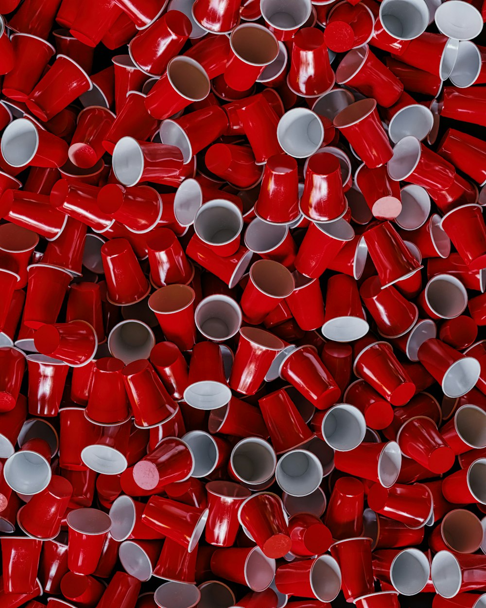 a pile of red and white cups sitting on top of each other