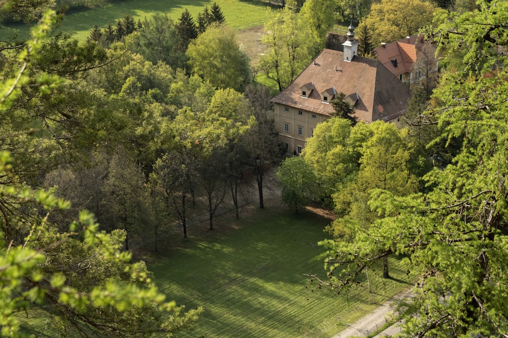 an aerial view of a house surrounded by trees