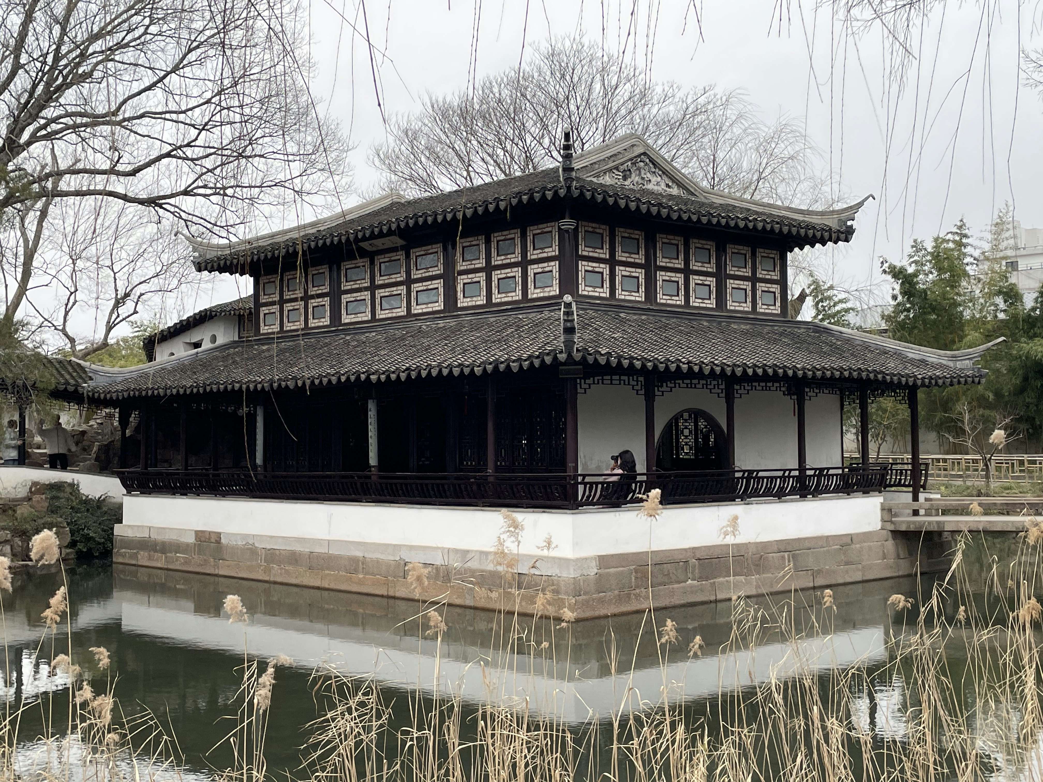 a building sitting next to a body of water