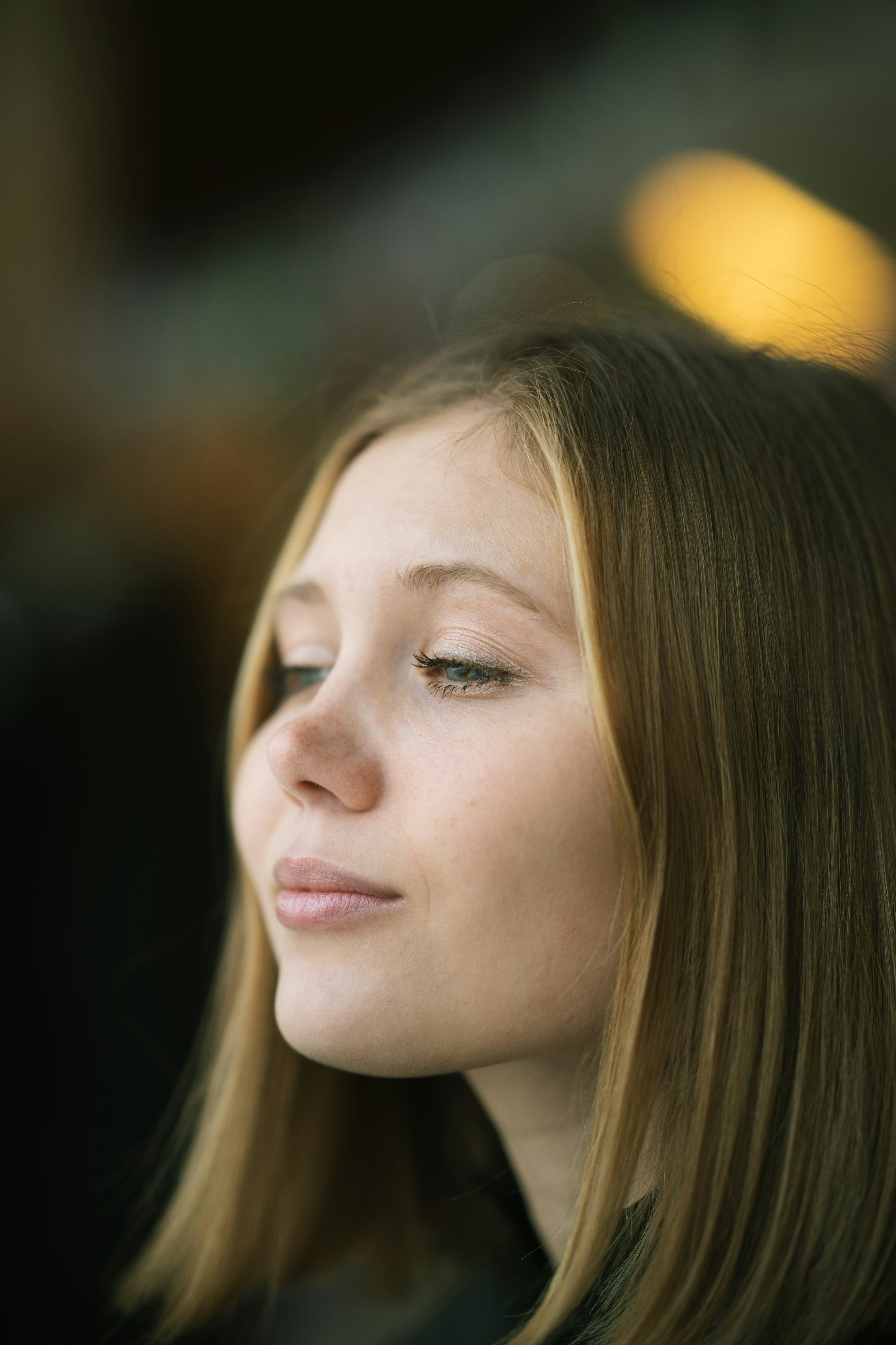 a close up of a person with a cell phone
