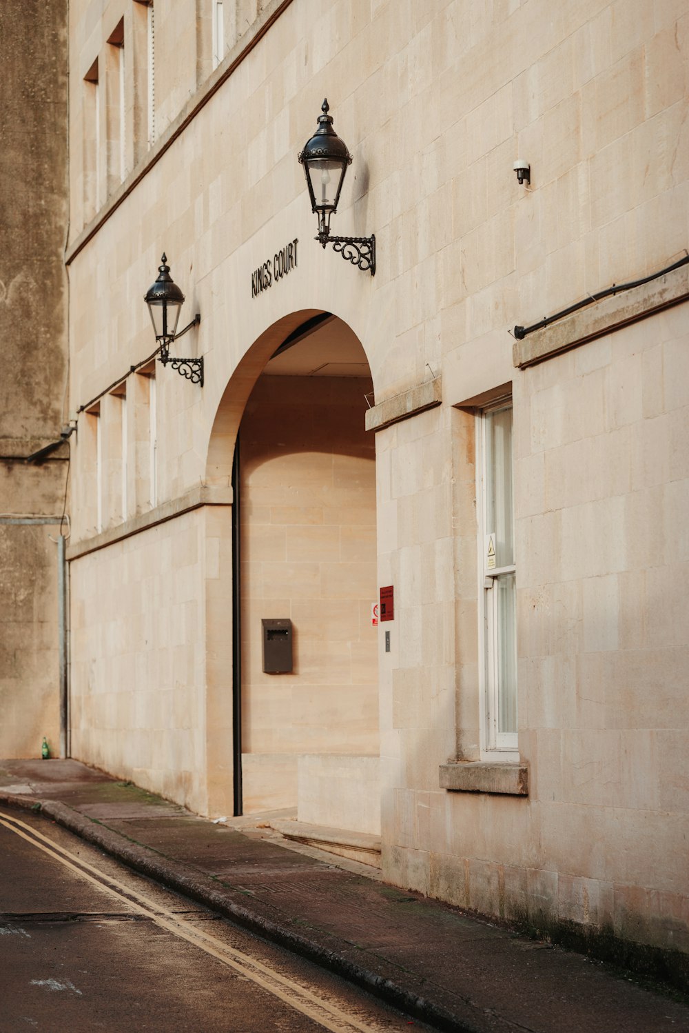 a building with a door and a light on the side of it