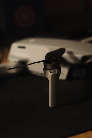 Close-up of drone propellers spinning with subtle lighting on black backdrop.