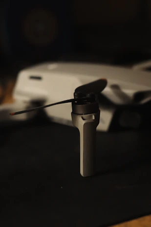 Close-up of a drone propeller being carefully cleaned with a soft brush.