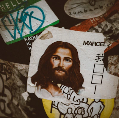 An artistic arrangement of various stickers and gadgets on a rustic wooden surface.