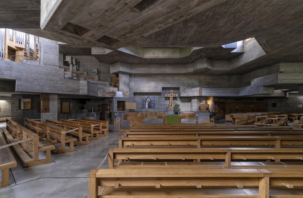 an empty church with wooden pews and pews