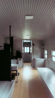 Compact studio interior showcasing clever built-in furniture and space-saving design.