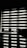 Horizontal blinds partially cover a window, creating a pattern of alternating light and shadow. Below the window, there is a reflective surface, possibly a table, displaying the same pattern along with a few small objects.