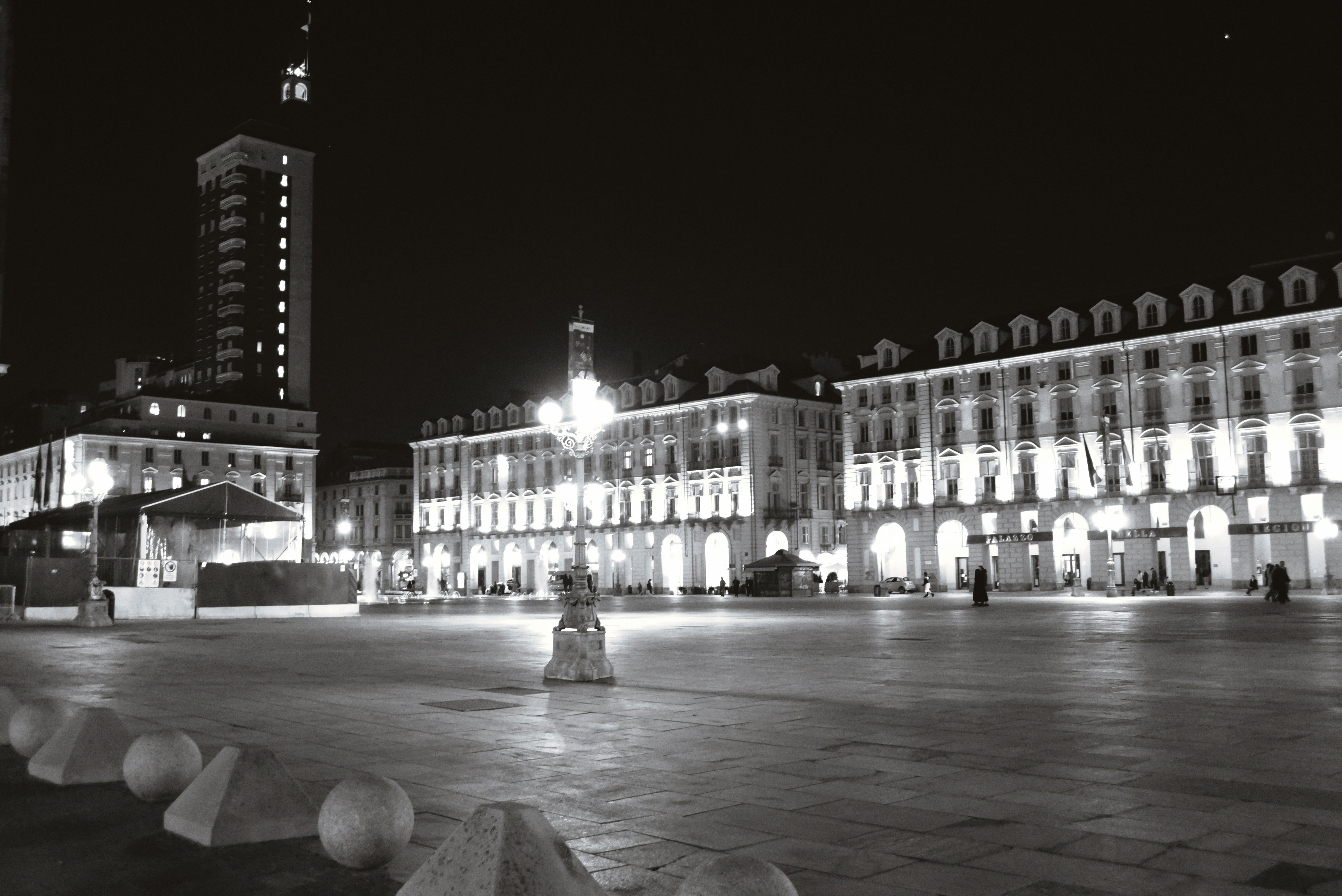 a black and white photo of a city at night