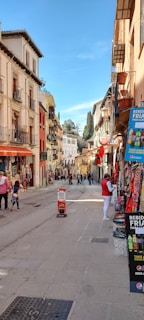 A vibrant street scene in Lille with colorful buildings and bustling pedestrians.