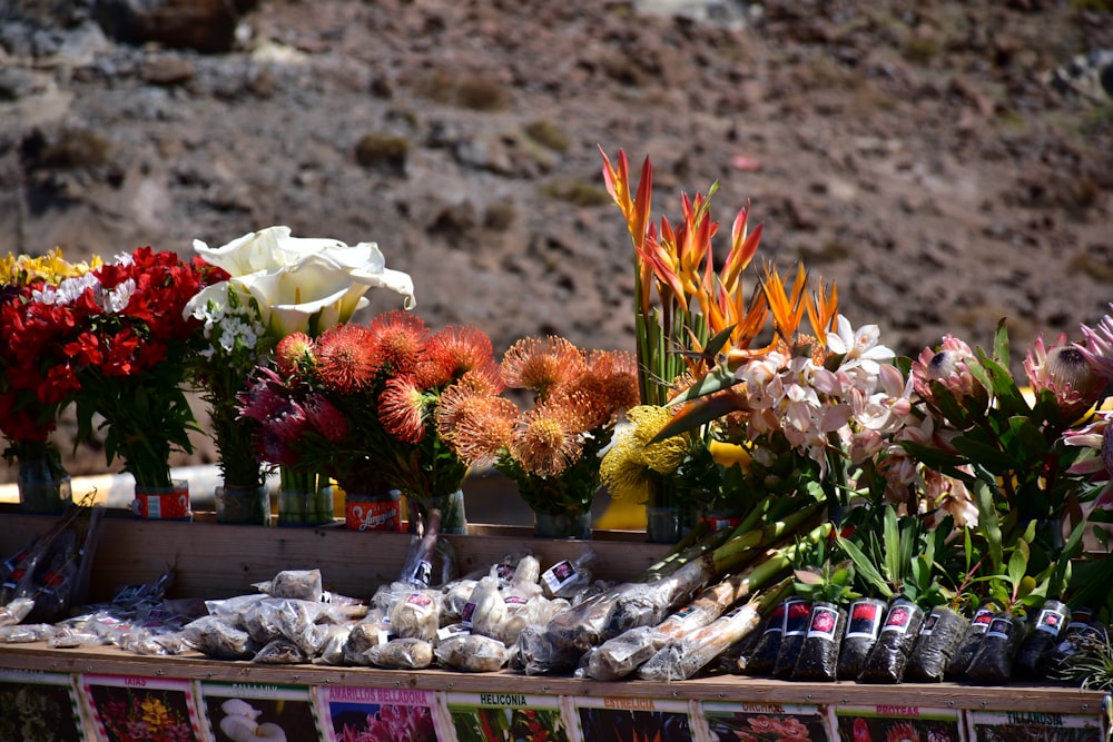 a bunch of flowers that are on a table