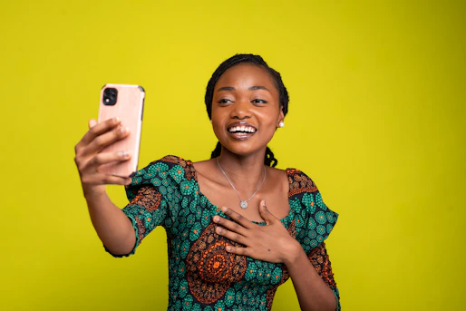 a woman taking a selfie with her cell phone