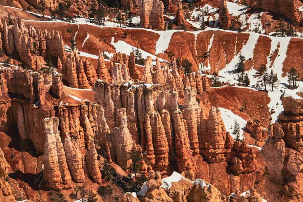 a snow covered mountain with a lot of rock formations