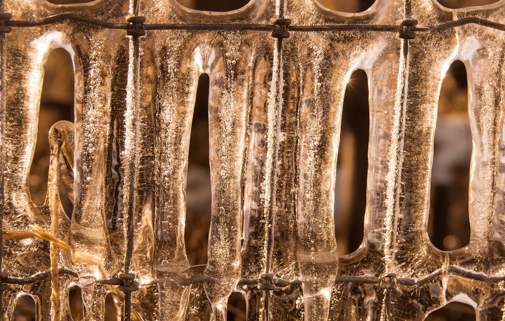 a close up of a metal grate with ice on it