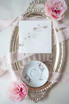 Elegant resin tray with floral inclusions resting on a cozy linen cloth