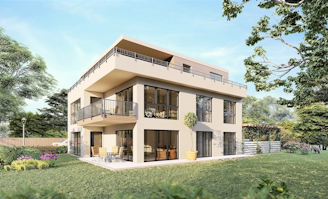 A modern, three-story house with large windows and balconies is surrounded by a lush, green garden. The building features contemporary architecture with clean lines and a flat roof. The garden is well-maintained with various trees, flowers, and a small patio area with outdoor furniture.
