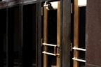 Close-up of a sleek metal door with an elegant handle
