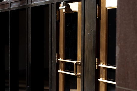 A variety of aluminum doors displayed in a showroom.