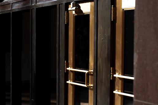 Close-up of various stylish doors displayed in a showroom.