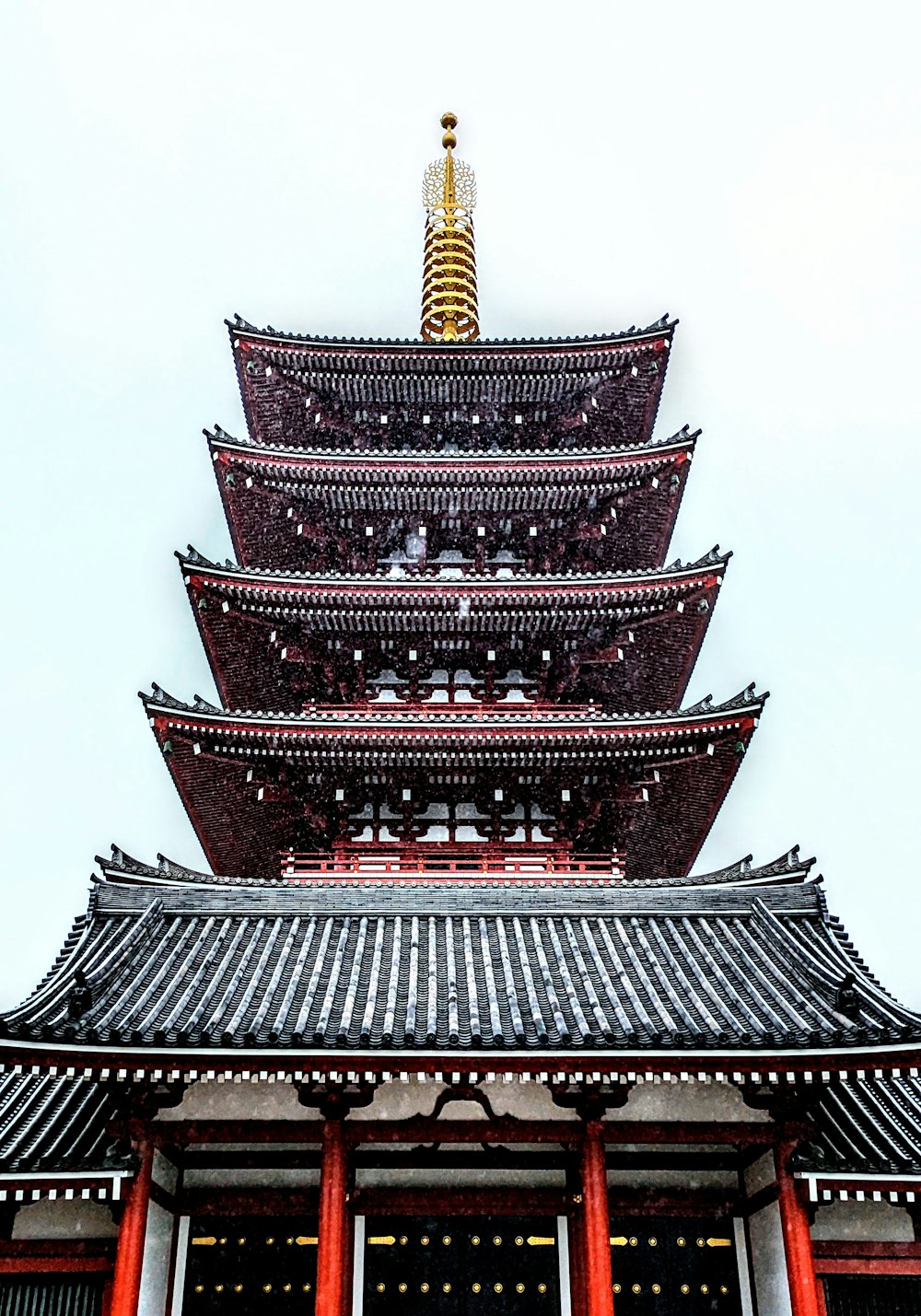 a tall tower with a clock on top of it