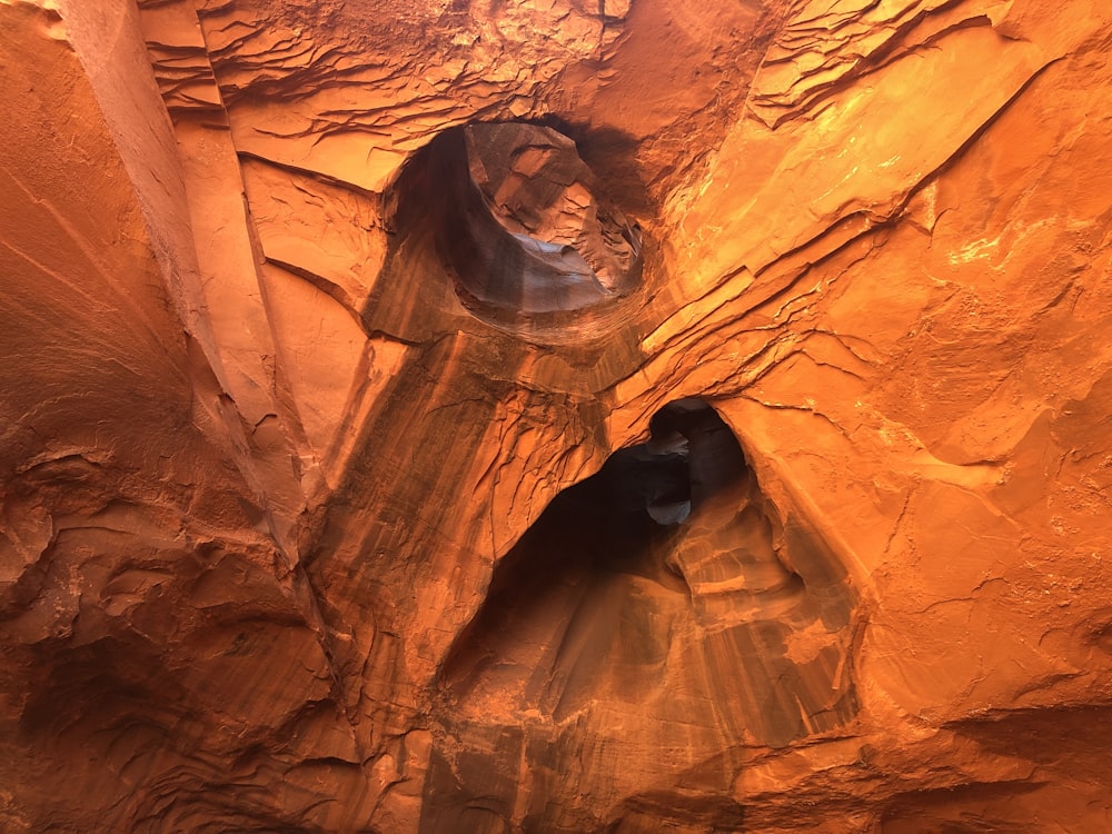 a person standing in a cave in the desert