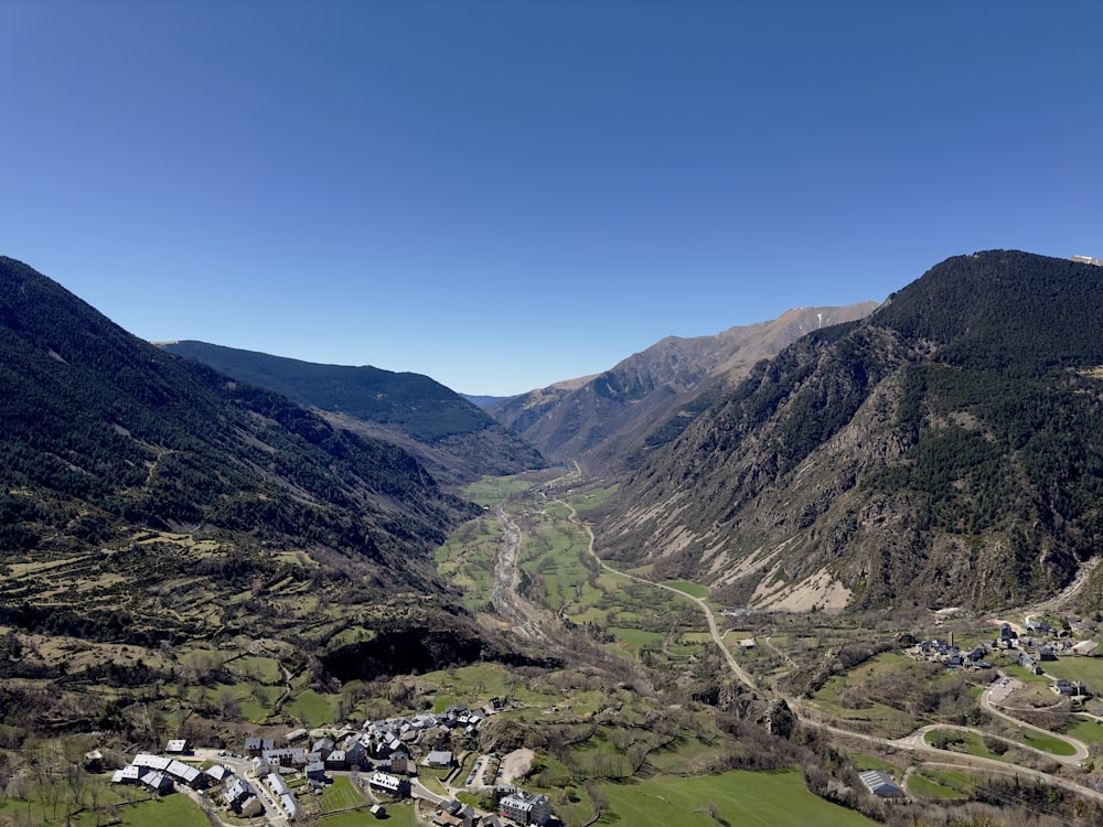 a scenic view of a valley with a river running through it