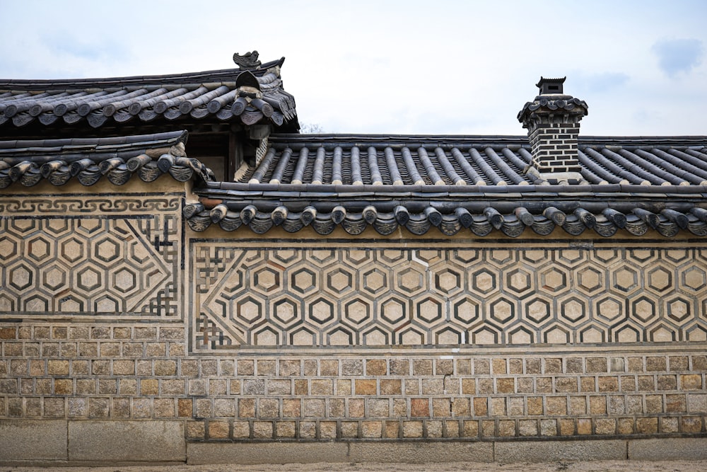 a building with a tiled roof and a clock tower