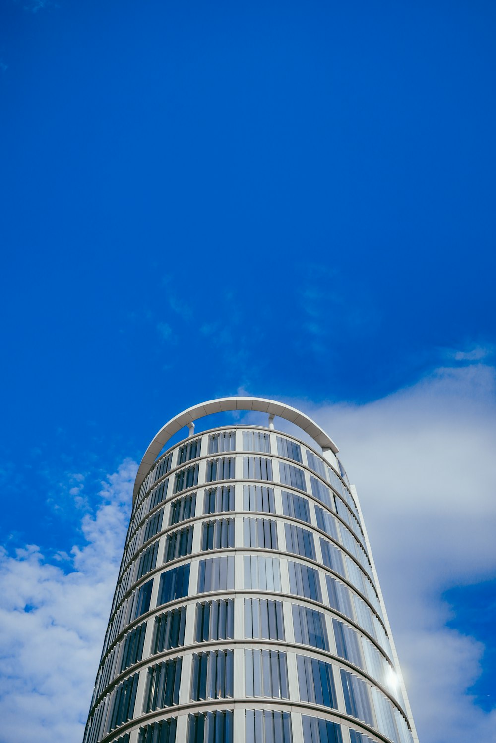 a very tall building with a sky background