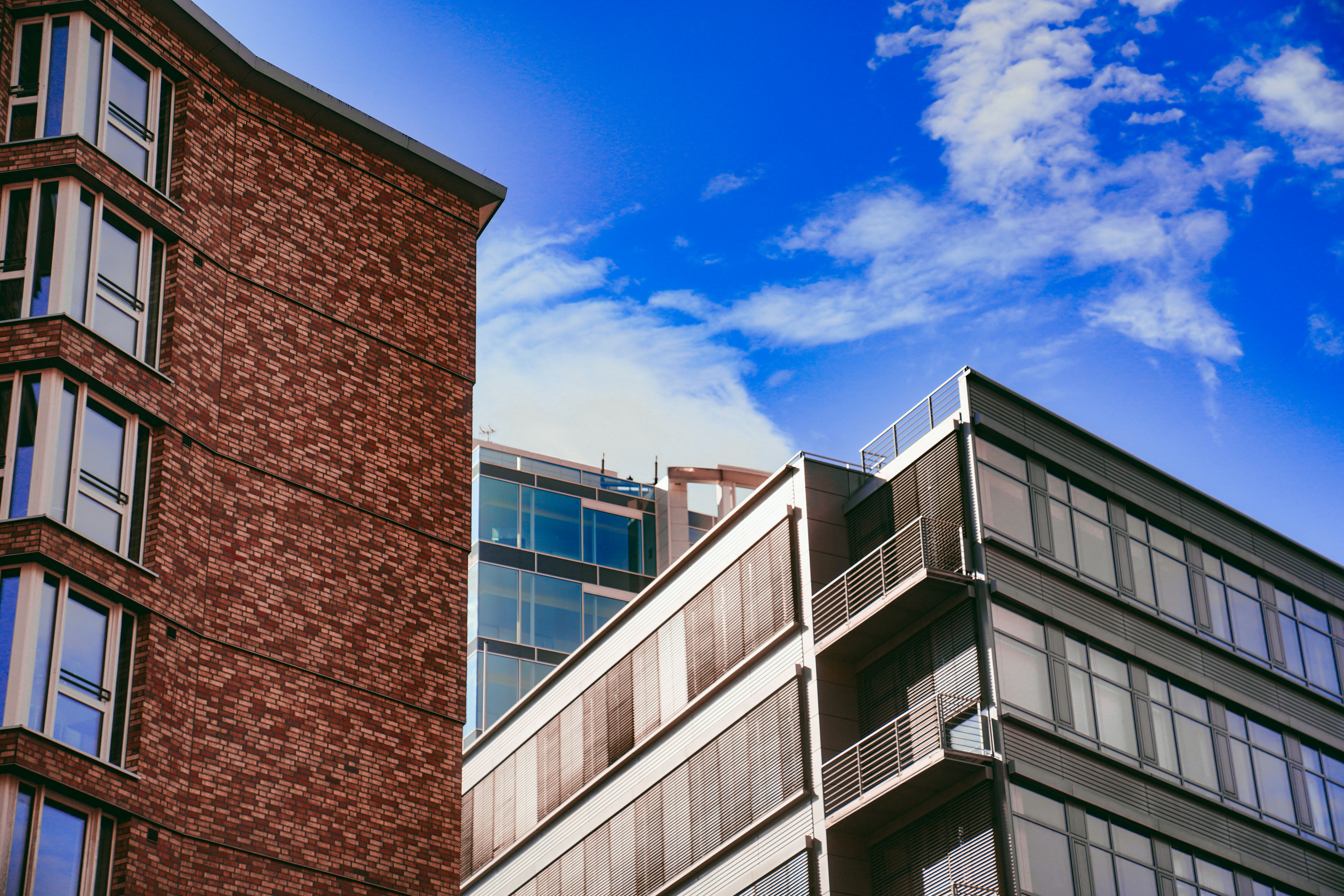 a tall brick building next to a tall brick building