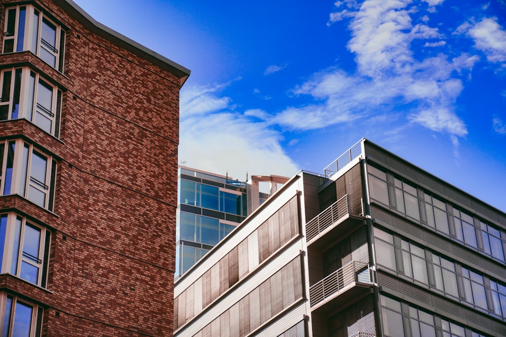 a tall brick building next to a tall brick building