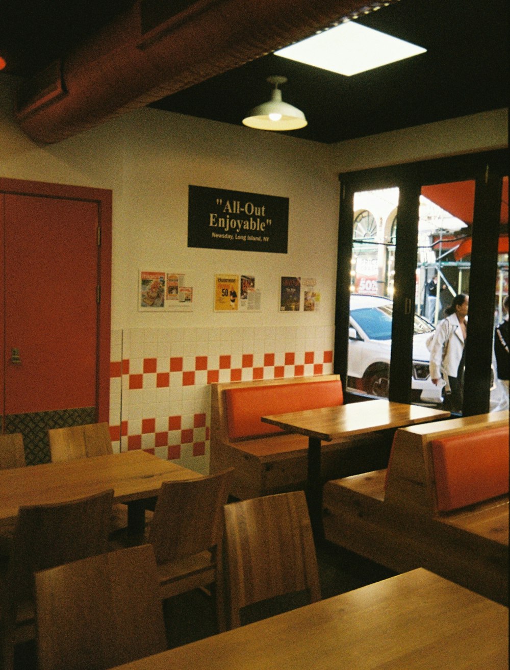 the inside of a restaurant with tables and chairs