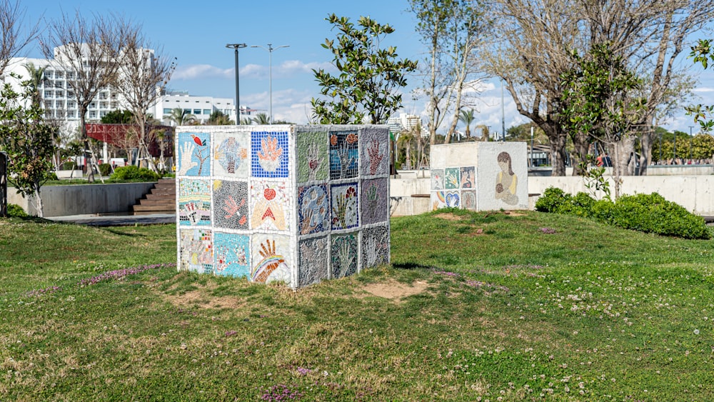 a sculpture in the middle of a grassy area