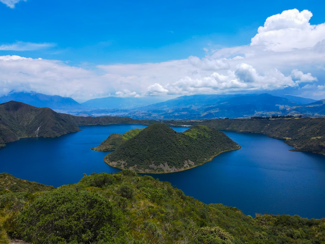 a large body of water surrounded by mountains,
