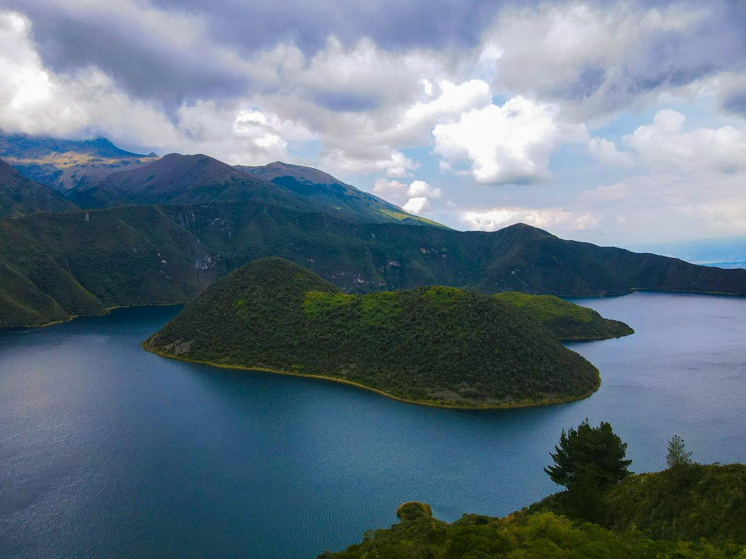 a large body of water surrounded by mountains,