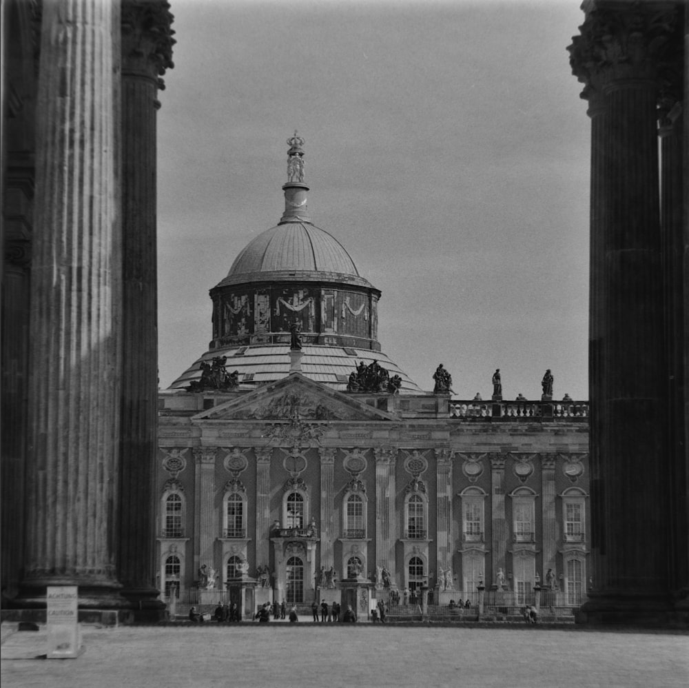 a black and white photo of a building with columns