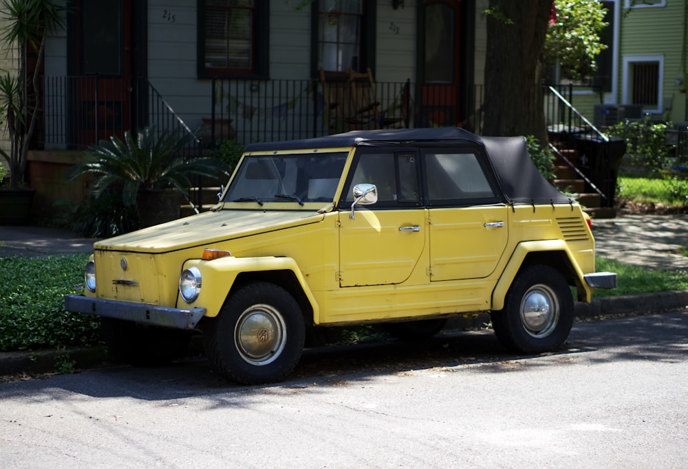 a yellow car parked on the side of the road