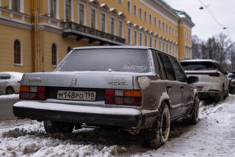 a car parked on the side of a snowy road