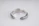 A silver open-ended ring with intricate patterns on the outer surface. The inside is engraved with the text 'COPPERTIST.WU S925 ANT' indicating sterling silver. The design is elegant and detailed, complemented by a smooth inner finish.